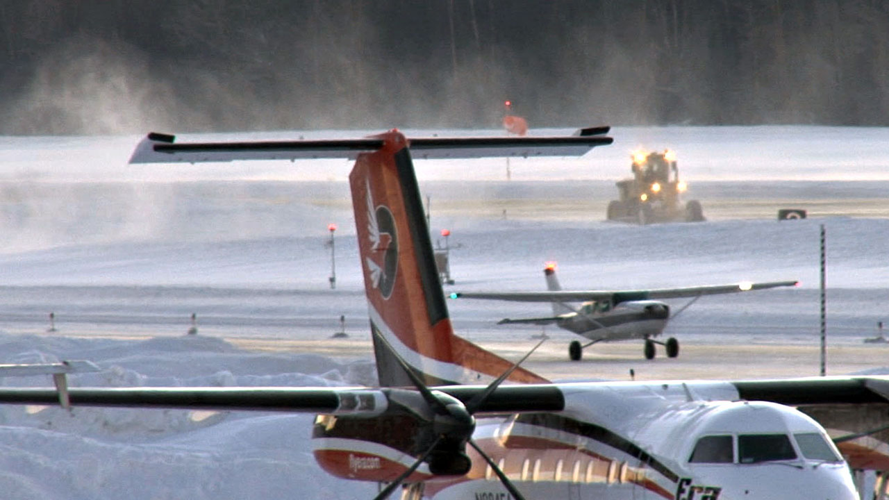 If necessary to take off from a slushy runway, the freezing of landing gear mechanisms can be minimized by: